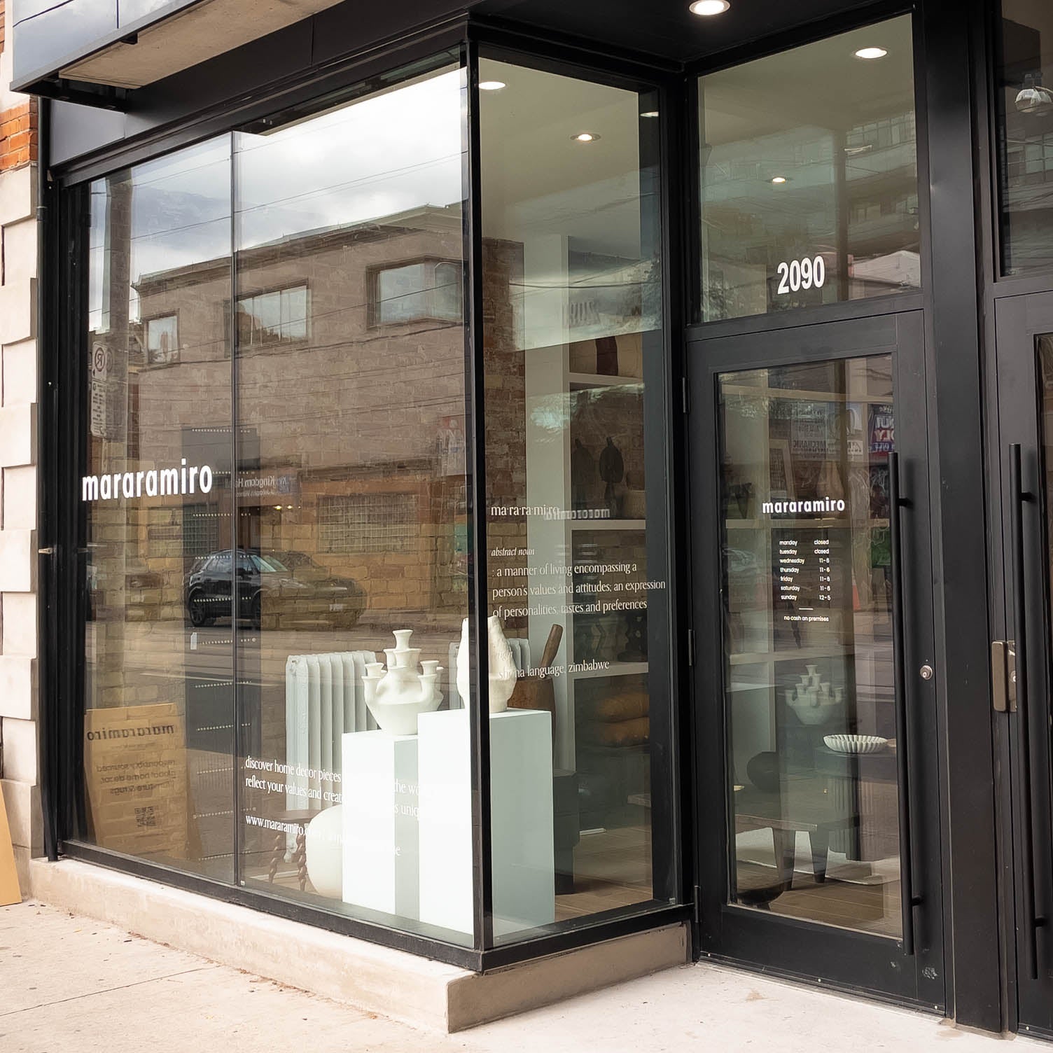 Modern storefront with glass doors and windows, featuring the brand 'mararamiro'.